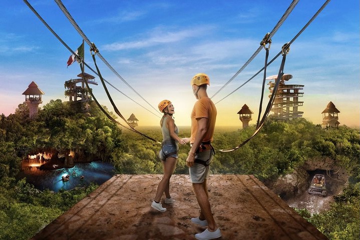 Guest zip-lining through the jungle canopy at Xplor Park